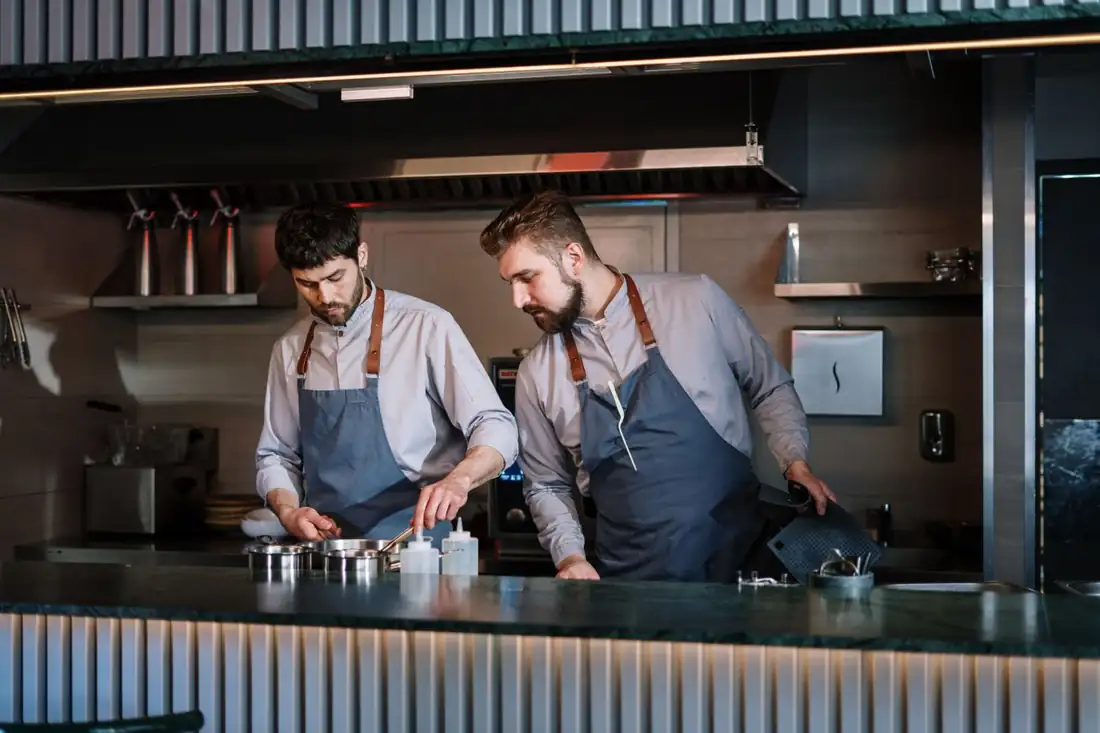 Two cooks working the line