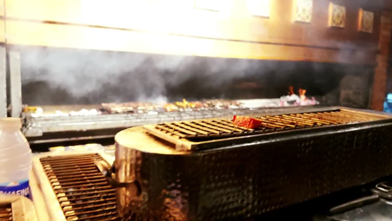 Chef grilling over the hearth