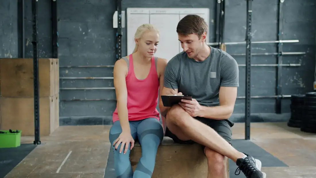 Ben, a coach, talking a client through a plan