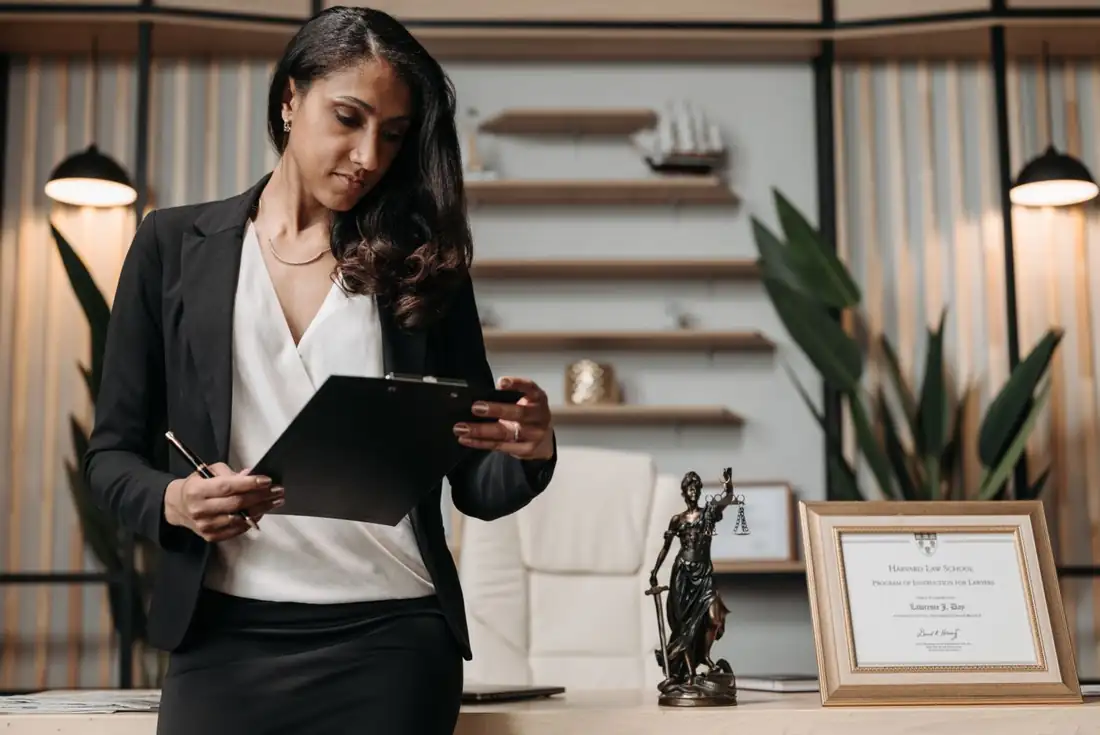 Ruth Calder, attorney, reviewing a tablet