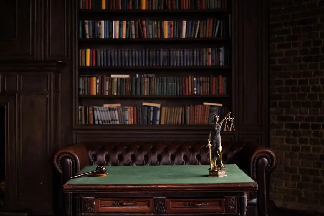 A quiet library room lined with law books