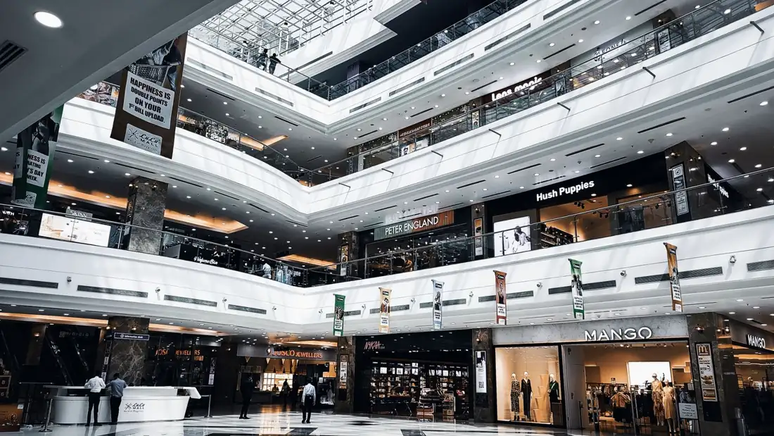 Inside a bright shop with racks of clothes